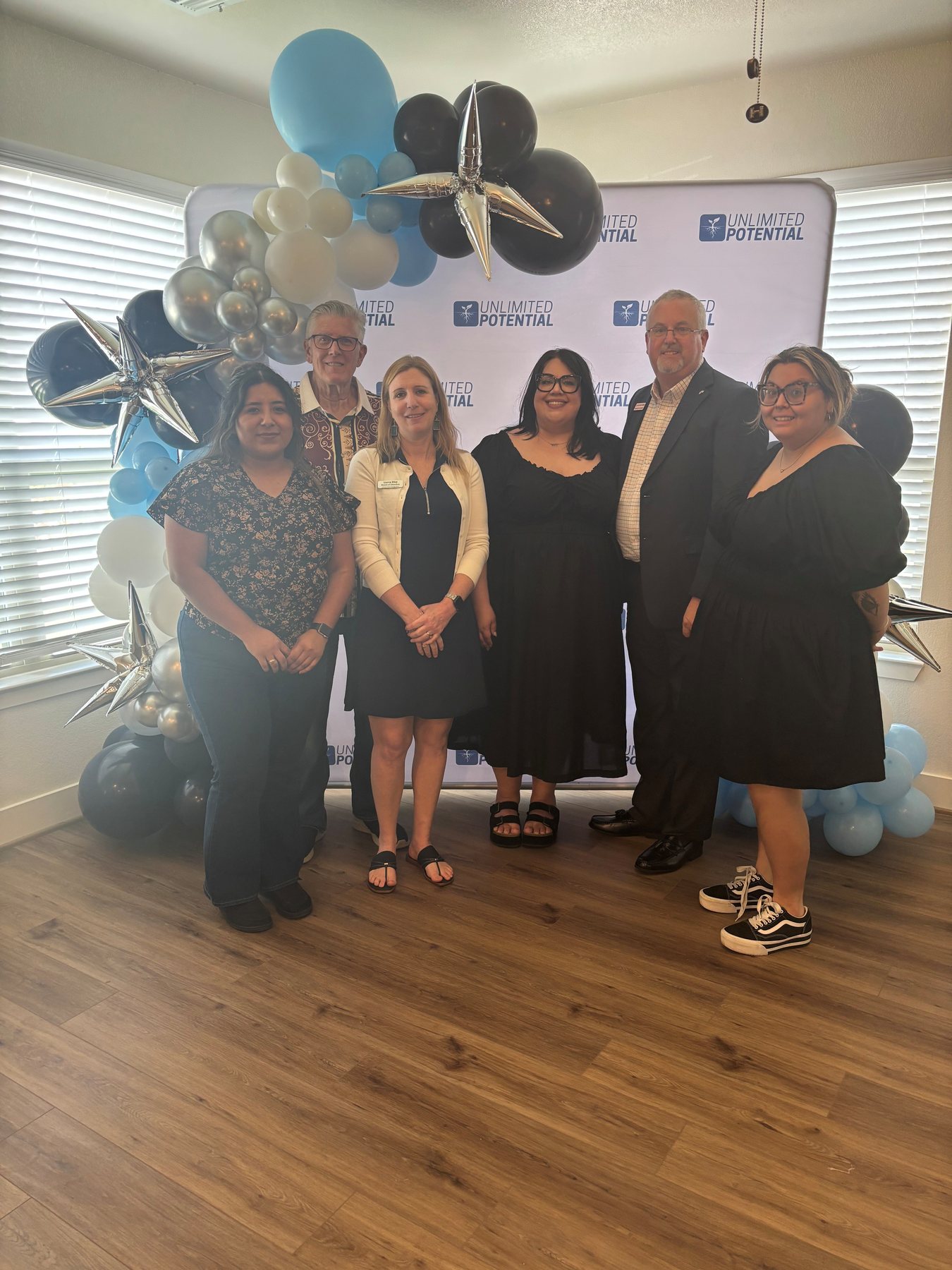 Members of the Unlimited Potential community at a celebration