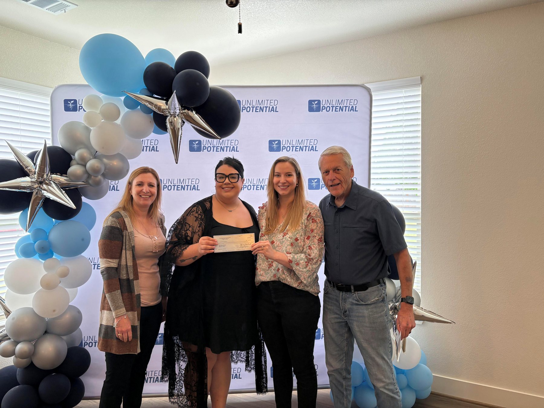 Community supporters presenting a donation